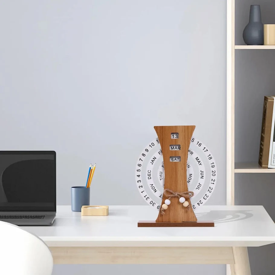 Wooden perpetual calendar styled on an office desk