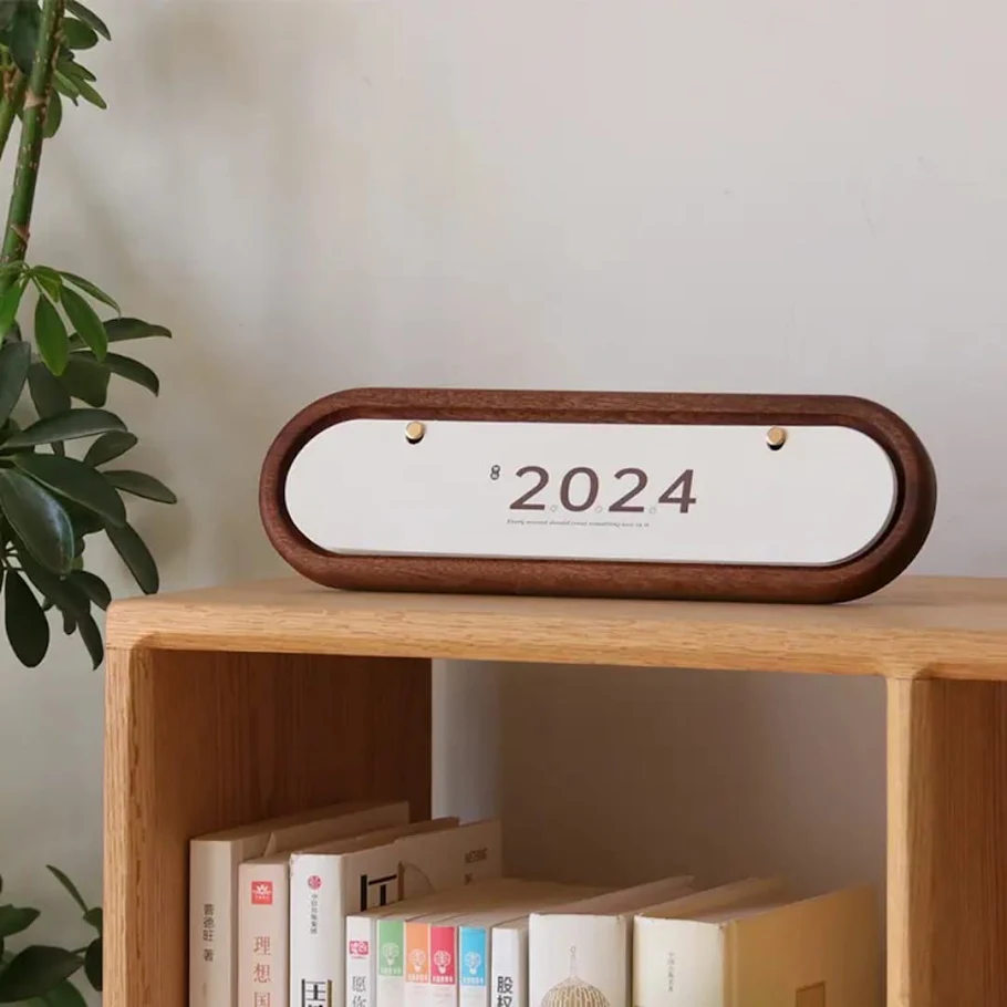 Walnut framed minimal year calendar on a shelf